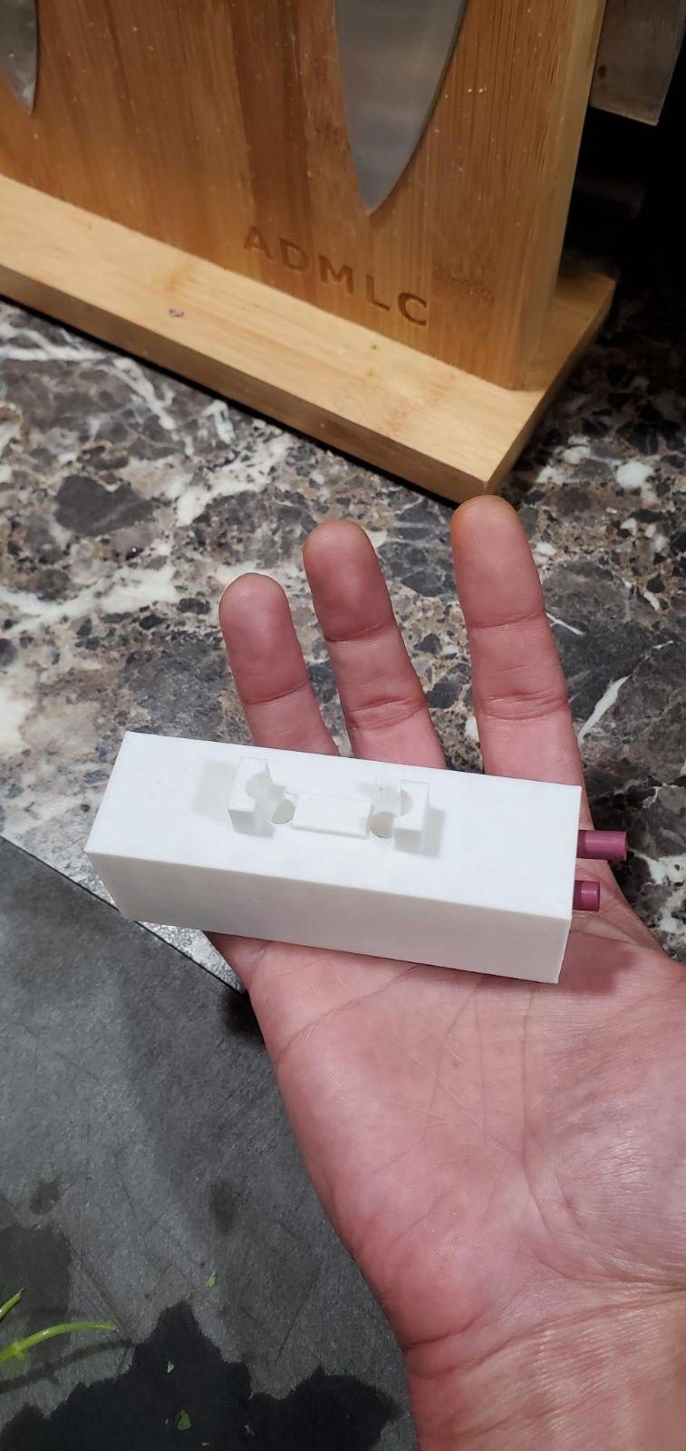 SharpCraft sharpener held in hand for scale